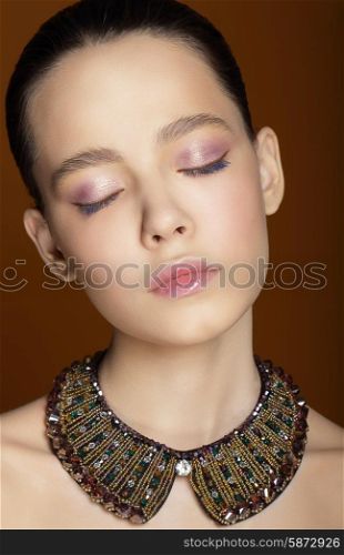 Dreamy Woman with Closed Eyes and Ornamental Necklace