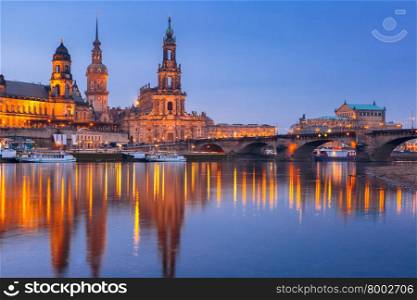 Dresden Cathedral of the Holy Trinity or Hofkirche, Bruehl&amp;#39;s Terrace or The Balcony of Europe, Semperoper and Augustus Bridge with reflections in the river Elbe at night in Dresden, Saxony, Germany
