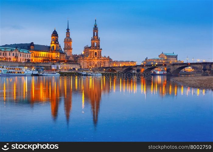 Dresden Cathedral of the Holy Trinity or Hofkirche, Bruehl&amp;#39;s Terrace or The Balcony of Europe, Semperoper and Augustus Bridge with reflections in the river Elbe at night in Dresden, Saxony, Germany