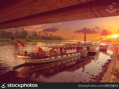 Dresden Elbe river and boats in Saxony Germany. Dresden Elbe river and boats at sunset in Saxony of Germany