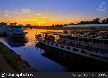 Dresden Elbe river and boats in Saxony Germany. Dresden Elbe river and boats at sunset in Saxony of Germany