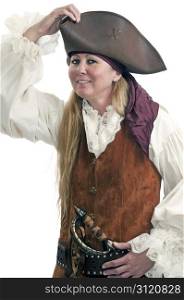 Dressed up for a Halloween costume party, a lady pirate adjusts the fit of her hat.