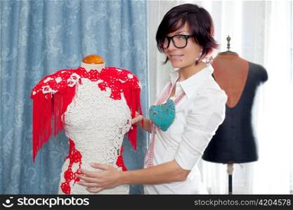 Dressmaker with mannequin as professional fashion designer