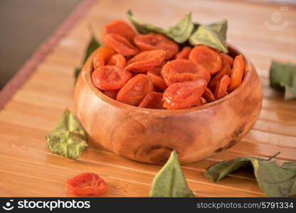 Dried apricots. Dried apricots in a wooden bowl