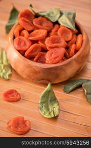 Dried apricots in a bowl. Dried apricots in a wooden bowl