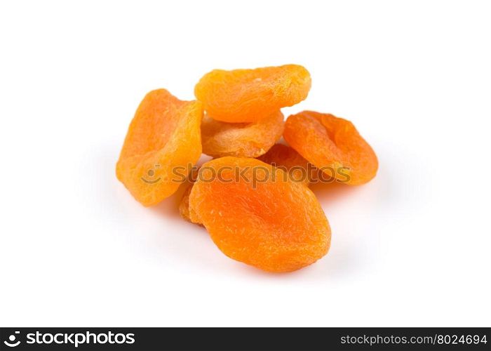 Dried apricots on white background with a light shadow