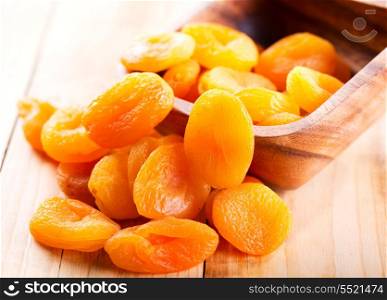 dried apricots on wooden table