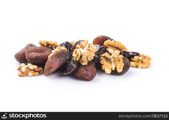 Dried apricots, walnut and plums in a white background