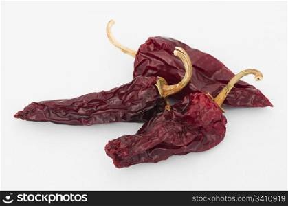Dried big red peppers. White isolated