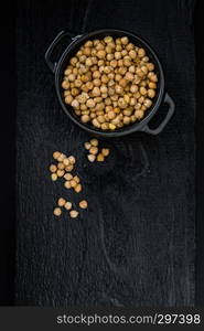 Dried Chick Peas on dark wooden background