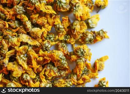 Dried chrysanthemum buds for herbal tea on white background, dry chrysanthemum flower yellow