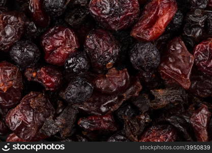 Dried cranberries, cherries and blueberries as a background