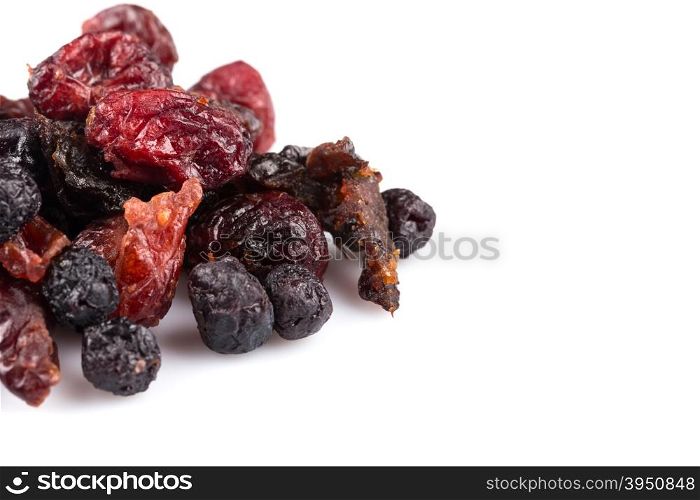 Dried cranberries, cherries and blueberries on white background