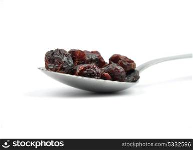 Dried cranberries on spoon