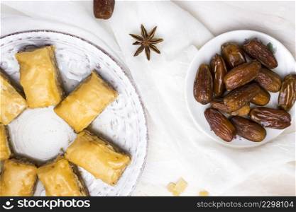 dried dates fruit with eastern sweets white table