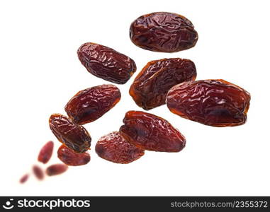 Dried dates levitate on a white background.. Dried dates levitate on a white background