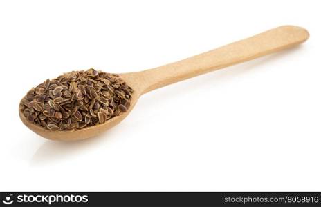 dried dill seeds in spoon isolated on white background