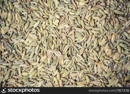 Dried fennel dill seeds as food background texture. Fennel dill seeds as food background