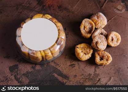 Dried figs in round plastic packaging on top view
