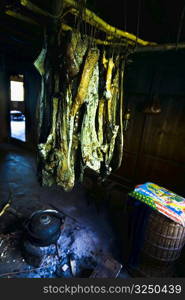 Dried fish hanging in a traditional kitchen, Jinkeng Terraced Field, Guangxi Province, China