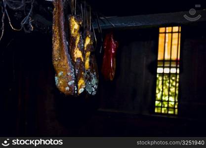 Dried fish hanging in front of a window, Jinkeng Terraced Field, Guangxi Province, China