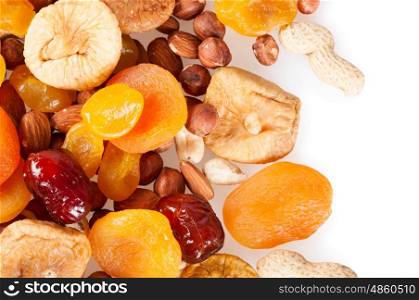 Dried fruits, dates, lemon, apricots, figs and nuts on a white background.