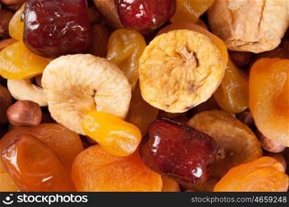 Dried fruits, nuts and dates. Top view. Candied fruits, lemon, apricot, fig and dates. Vegan concept.