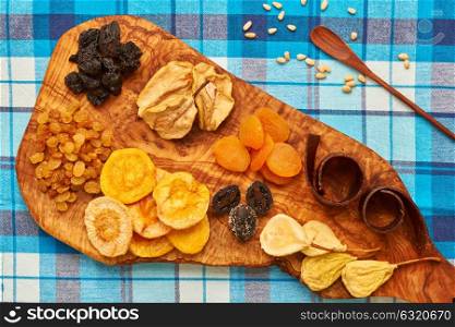 Dried fruits on blue tablecloth