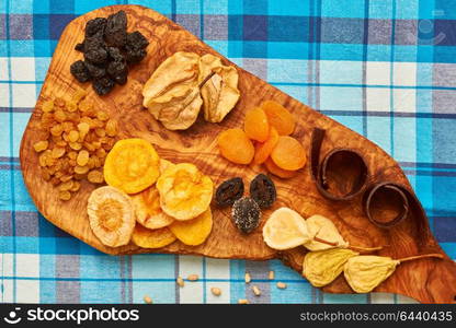 Dried fruits on blue tablecloth