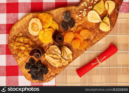 Dried fruits on red tablecloth