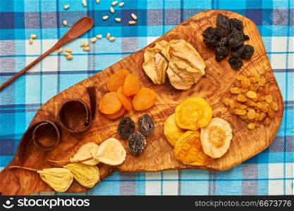Dried fruits on tablecloth. Dried fruits on blue tablecloth