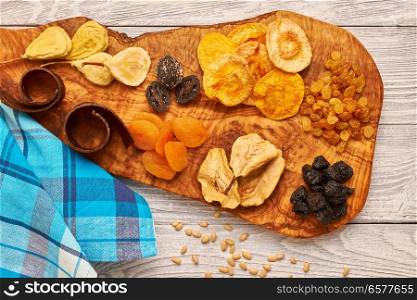 Dried fruits on vintage rustic wooden background 