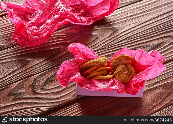 Dried fruits on wooden background . Dried fruits on vintage rustic wooden background