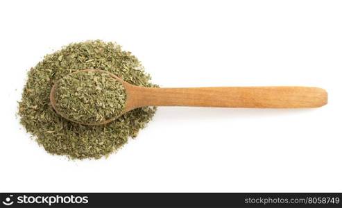dried green spices and spoon isolated on white background