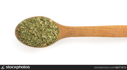 dried green spices and spoon isolated on white background