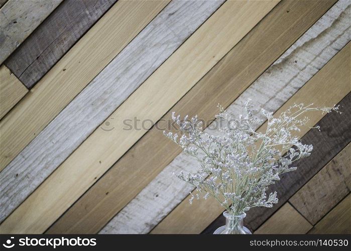 Dried gypsophila flower on wooden background, stock photo