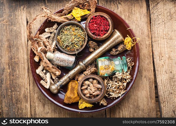 Dried herbs for use in herbal medicine.Medicinal herbs and ingredients on vintage wooden background.. Selection healing herbs