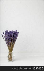 dried lavender with white background in a glass