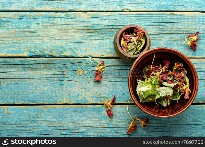 Dried leaves and flowers of nasturtium.Medicinal herbs.Herbal medicine and homeopathy.Space for text. Nasturtium in herbal medicine,copy space