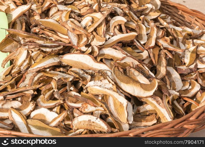 dried mixed porcini mushrooms in wicker bowl