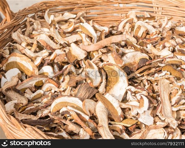 dried mixed porcini mushrooms in wicker bowl