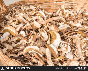 dried mixed porcini mushrooms in wicker bowl