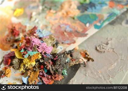 dried multi-colored paint. concept: artistic and creative chaos. art craft, paints