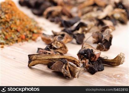 Dried mushrooms in heap on wooden table