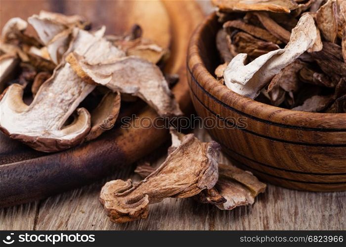 dried mushrooms, on a wooden table