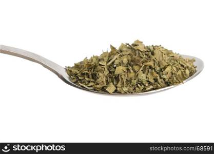 Dried parsley isolated in spoon on white background