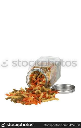Dried pasta spilling from jar