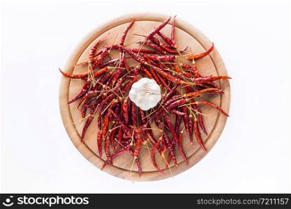 Dried peppers and garlic for cooking on a white background.