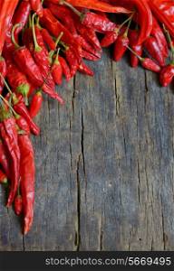 dried red chili pepper on wooden table