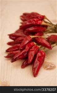 Dried Red Chilli Peppers on Wooden Table
